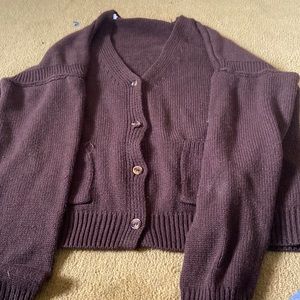 A brown knitted sweater/cardigan